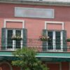 Several decorative steel railing planters outside a restaurant
