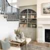Side mount baluster bracket with modern stairs and decor in living room. close-up. Project by Ashley Webb Interiors.